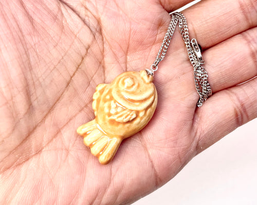 Gold fish-shaped pendant With sterling silver necklace
