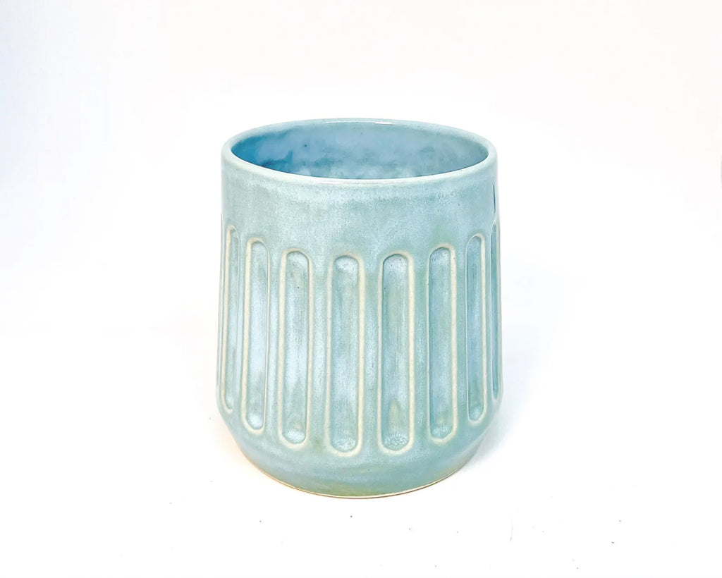 Light blue ceramic tumbler with vertical ribbed design 