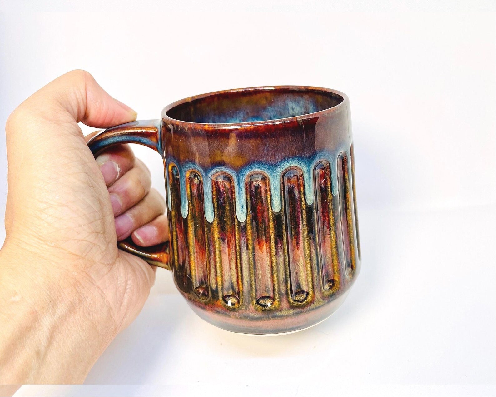 Ceramic doric design mug with tiger's eye and stone denim glaze