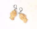 Taiyaki-shaped earrings on a white background