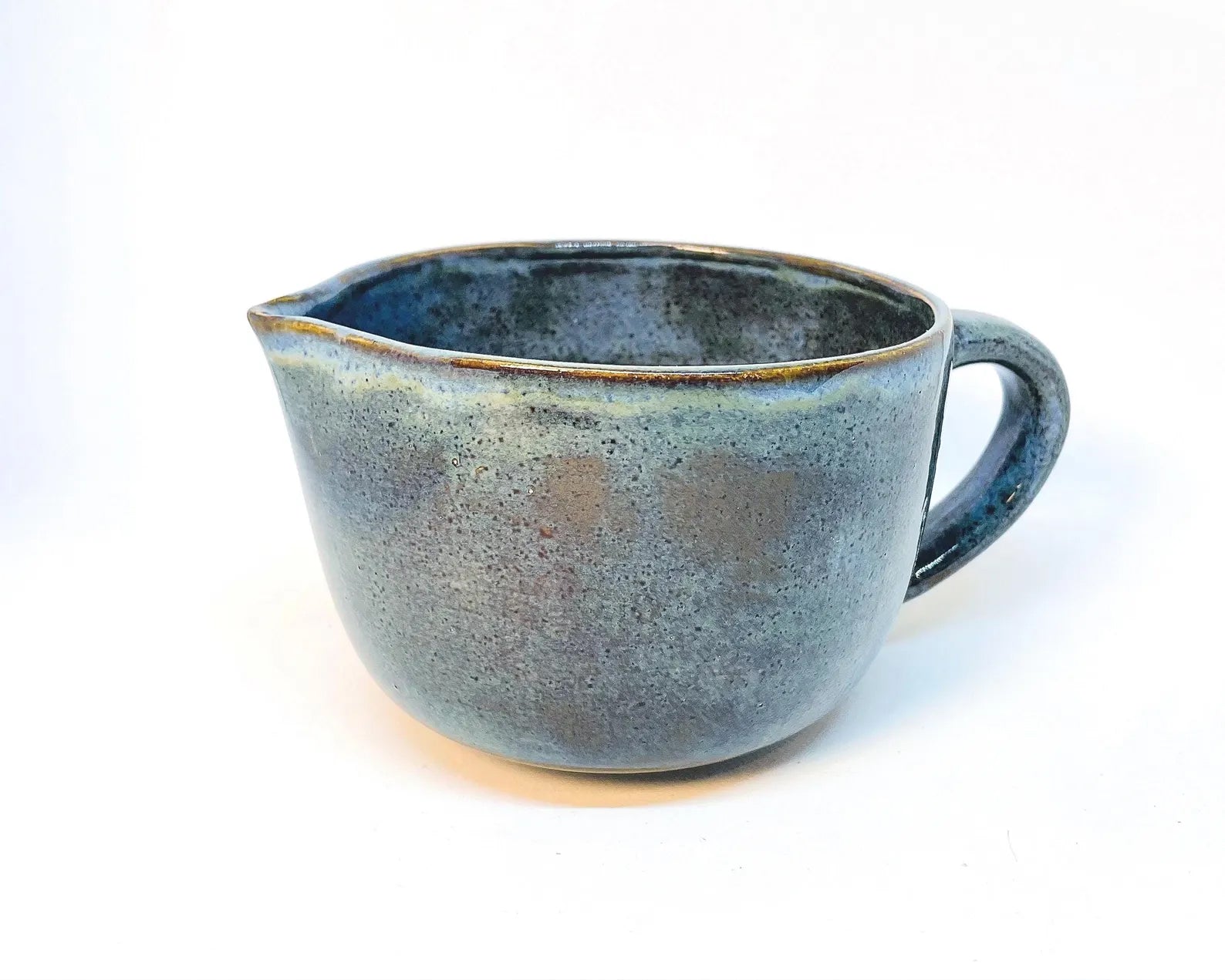 Stoned Denim glaze ceramic Matcha bowl with handle on a white background