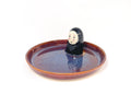 Relax with this charming handmade Noface incense holder and trinket dish. Perfect for holding jewelry or burning your favorite incense, this ceramic piece adds a touch of "kawaii" to your home.