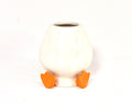 White ceramic chasen holder with orange feet on a white background